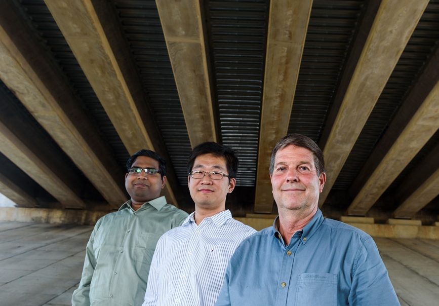 Three professors under a bridge